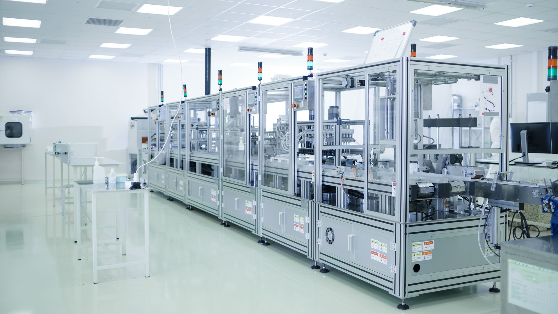 Shot of Sterile Precision Manufacturing Laboratory with 3D Printers, Super Computers and other Electrical Equipment and Machines suitable for Pharmaceutics, Biotechnology and Semiconductor Researches.
